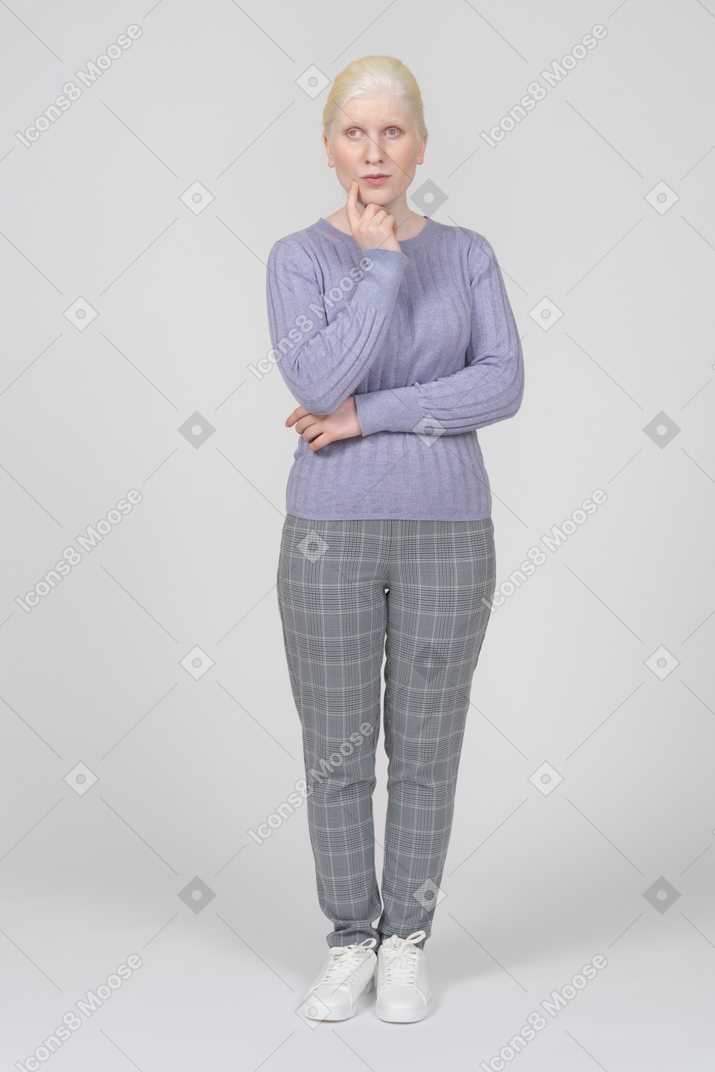 Front view of a woman in casual clothes thinking