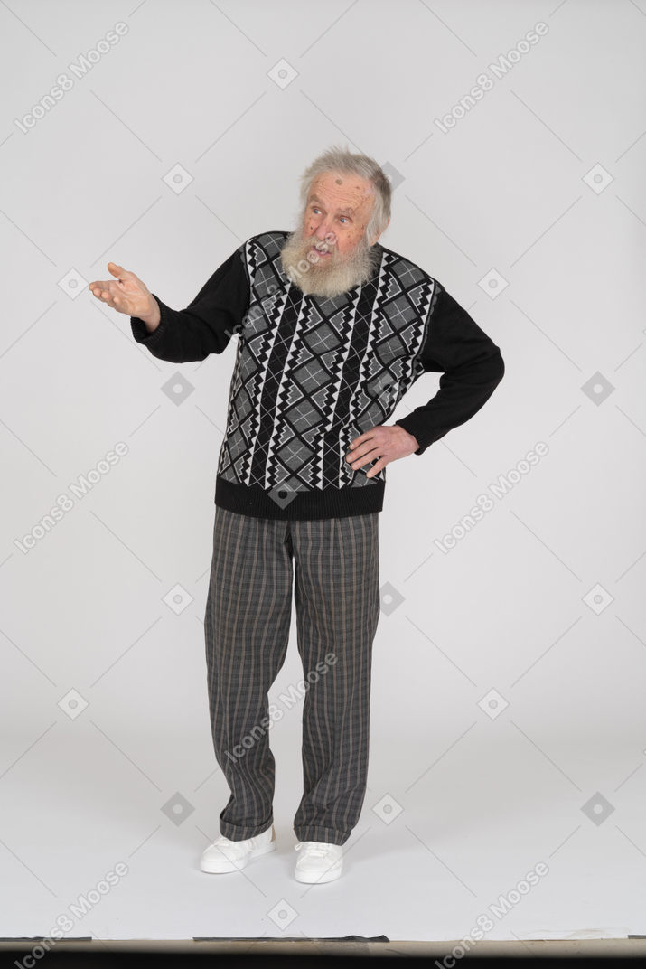 Front view of a puzzled old man gesturing questioningly