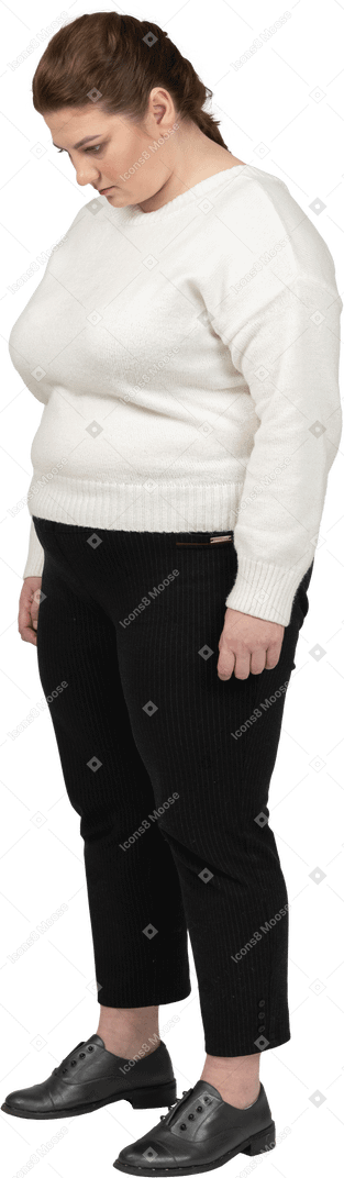 Plump woman in casual clothes standing