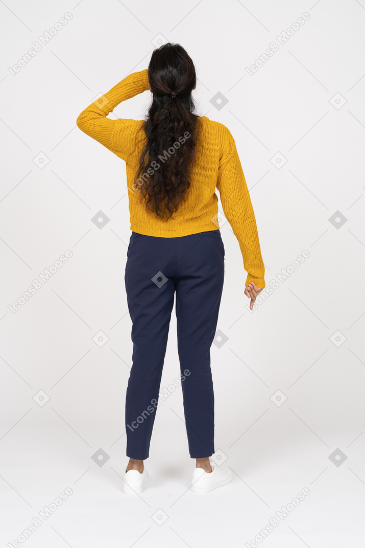 Back view of a girl in casual clothes touching forehead