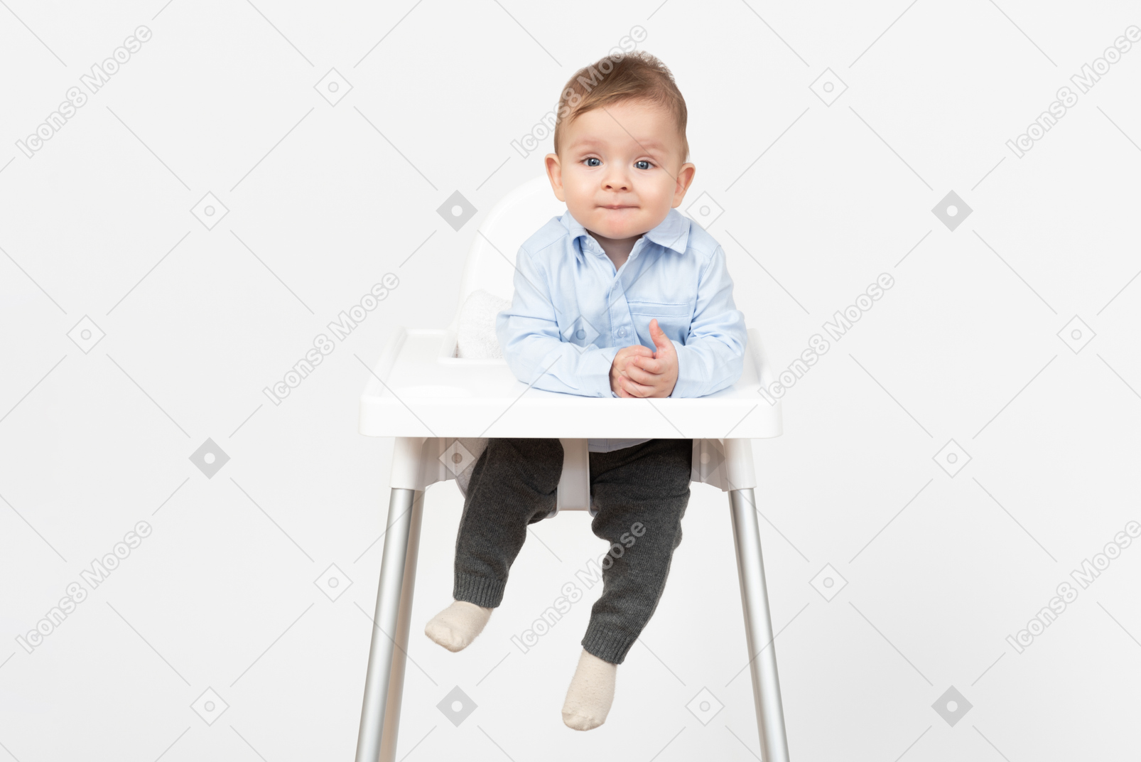 Baby boy sitting in highchair