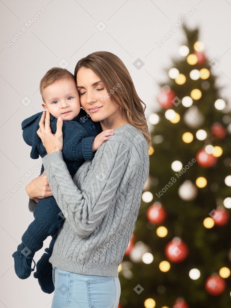Happy mother holds her best gift