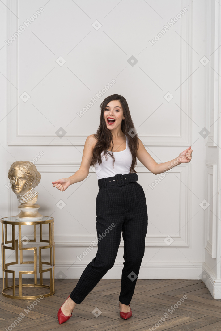 Young businesswoman dancing in joy