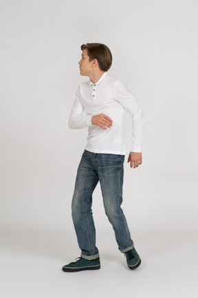 Young man in casual clothes standing