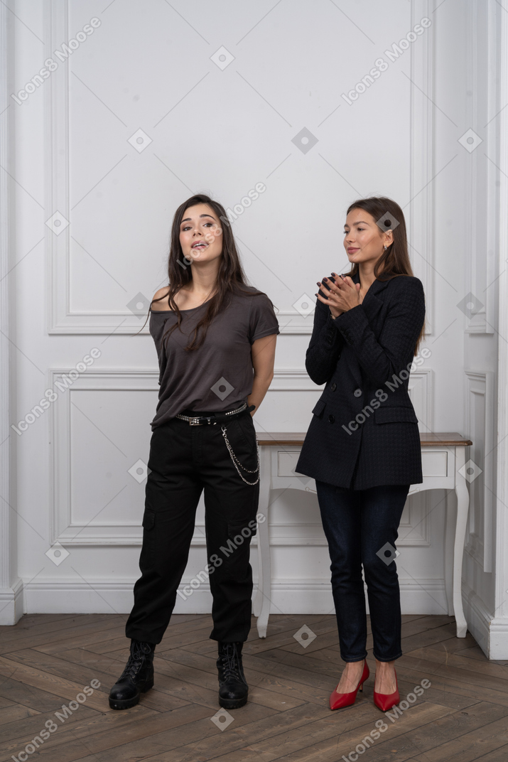 Two women looking distracted