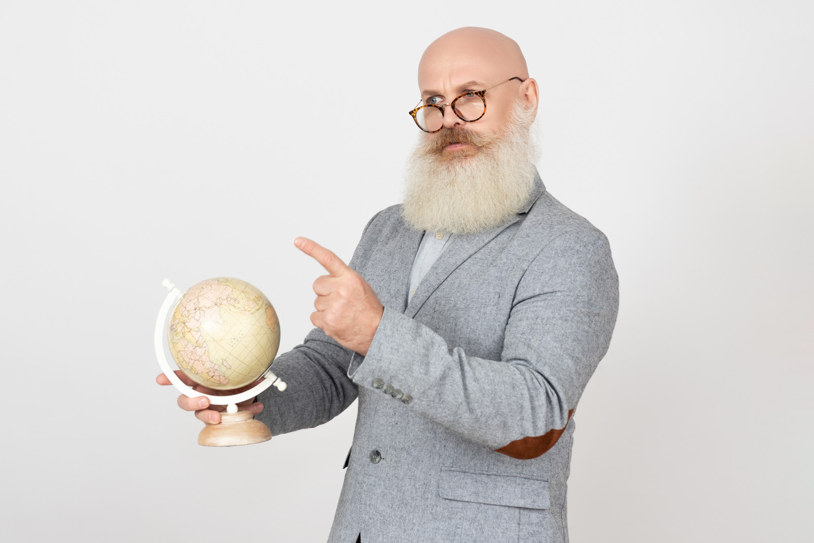 Severe looking old professor holding globus and pointing something