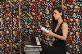 Female pianist reading musical notation