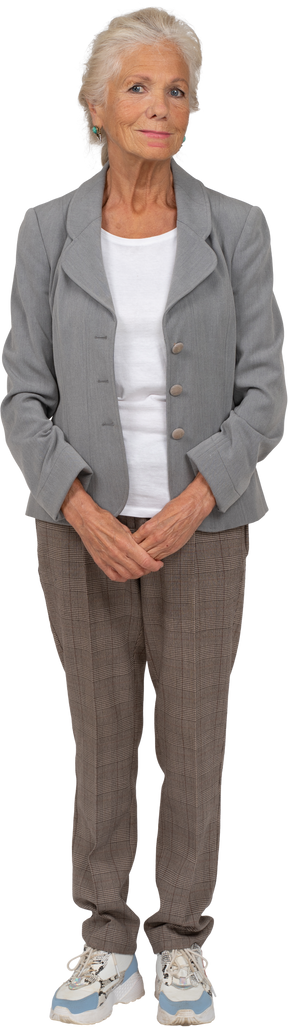 Front view of a happy old lady in suit looking at camera