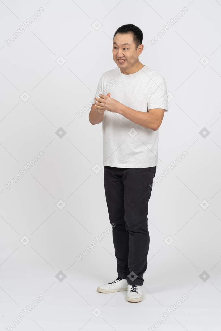 Front view of a happy man rubbing hands