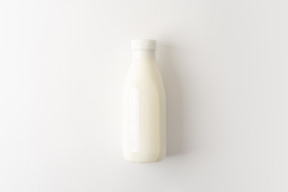 Small plastic bottle with some dairy product inside