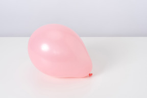 Pink balloon on a white background