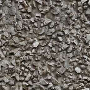 Concrete wall with stone inclusions