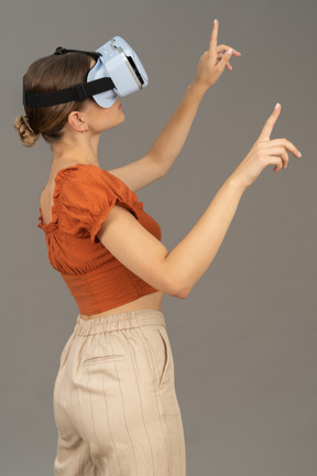 Side view of young woman in vr headset