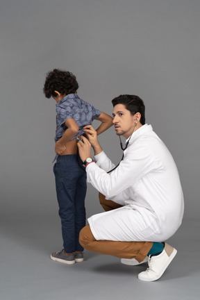 Doctor examining kid