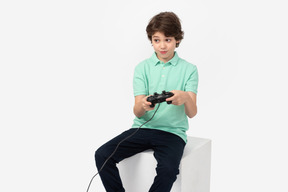 Cute boy playing video games