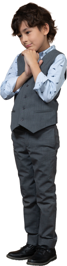 Front view of a cute boy in grey suit