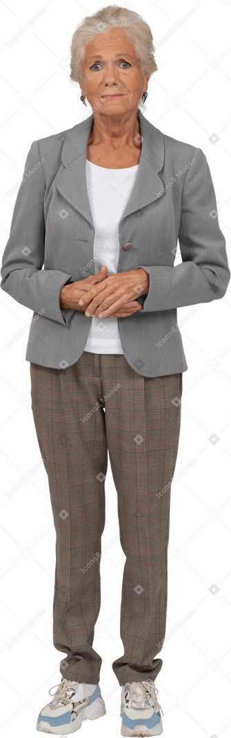 Front view of an old woman in suit looking at camera