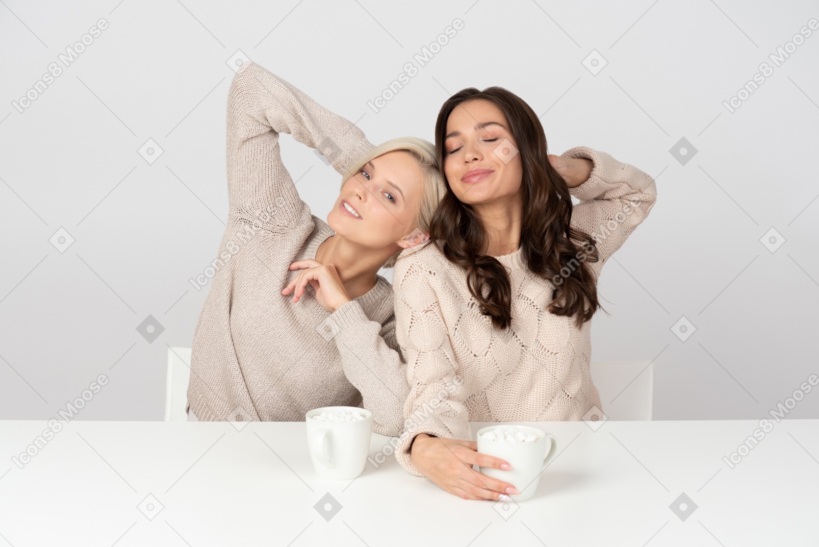 Young women posing with cookies and coffee