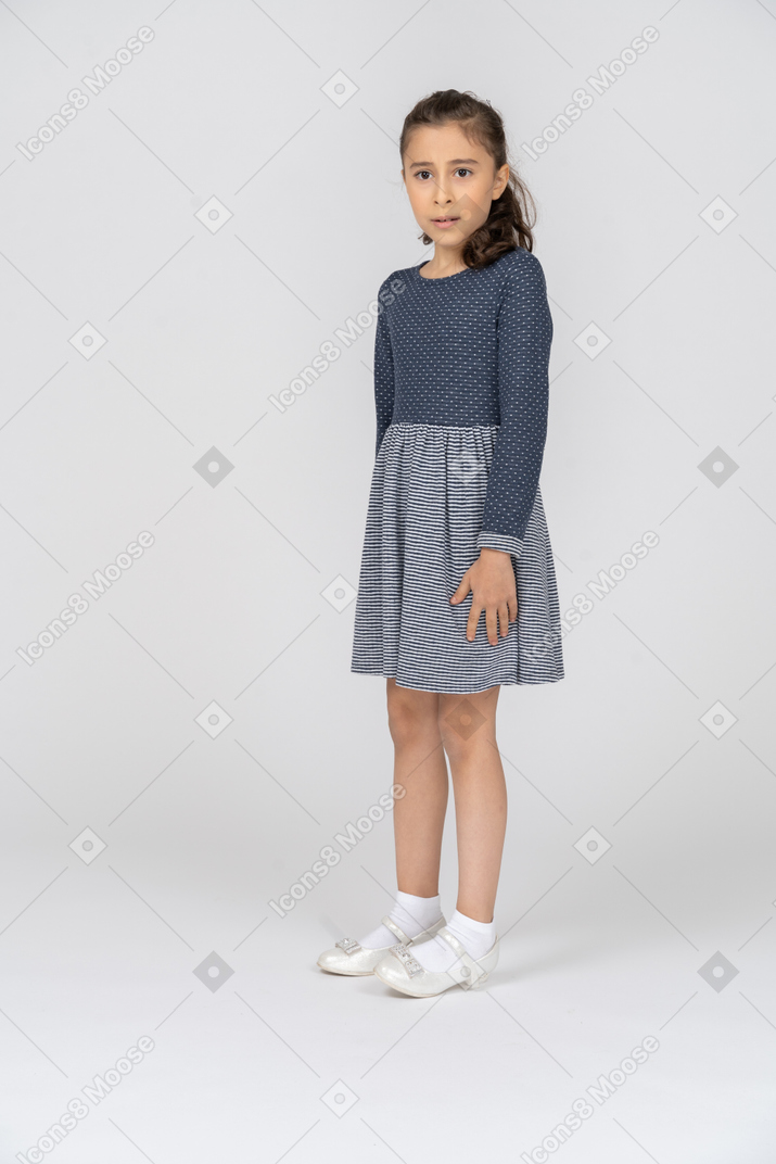 Three-quarter view of a girl looking aghast and bewildered