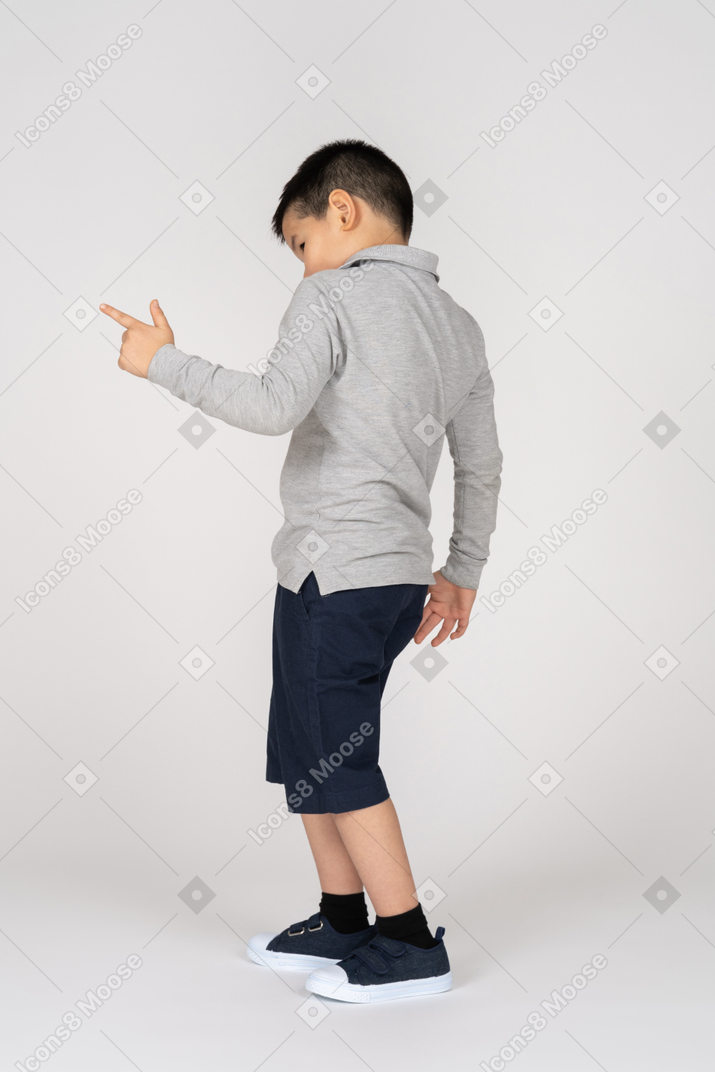 Boy pointing at something
