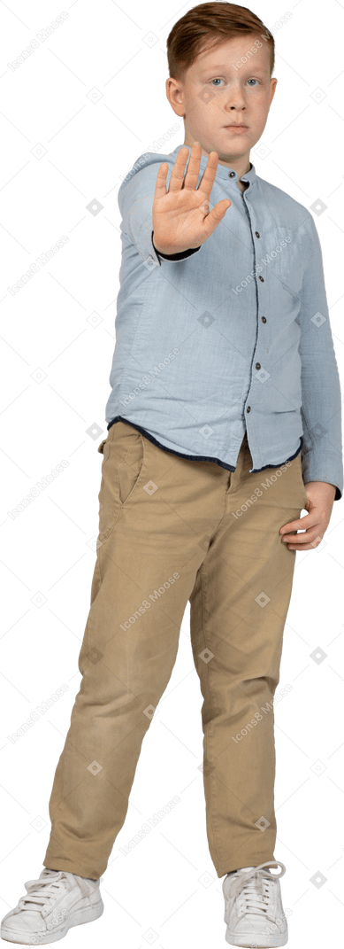 Front view of a cute boy standing with extended arm