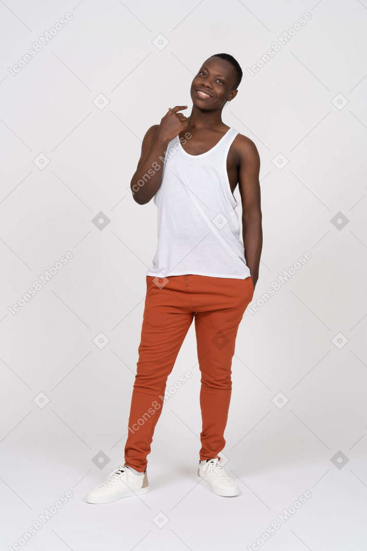 Smiling man in tank top pointing at himself