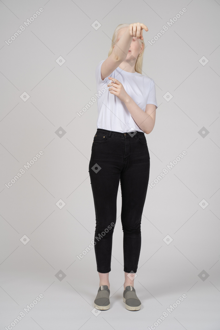 Woman in casual clothes pointing