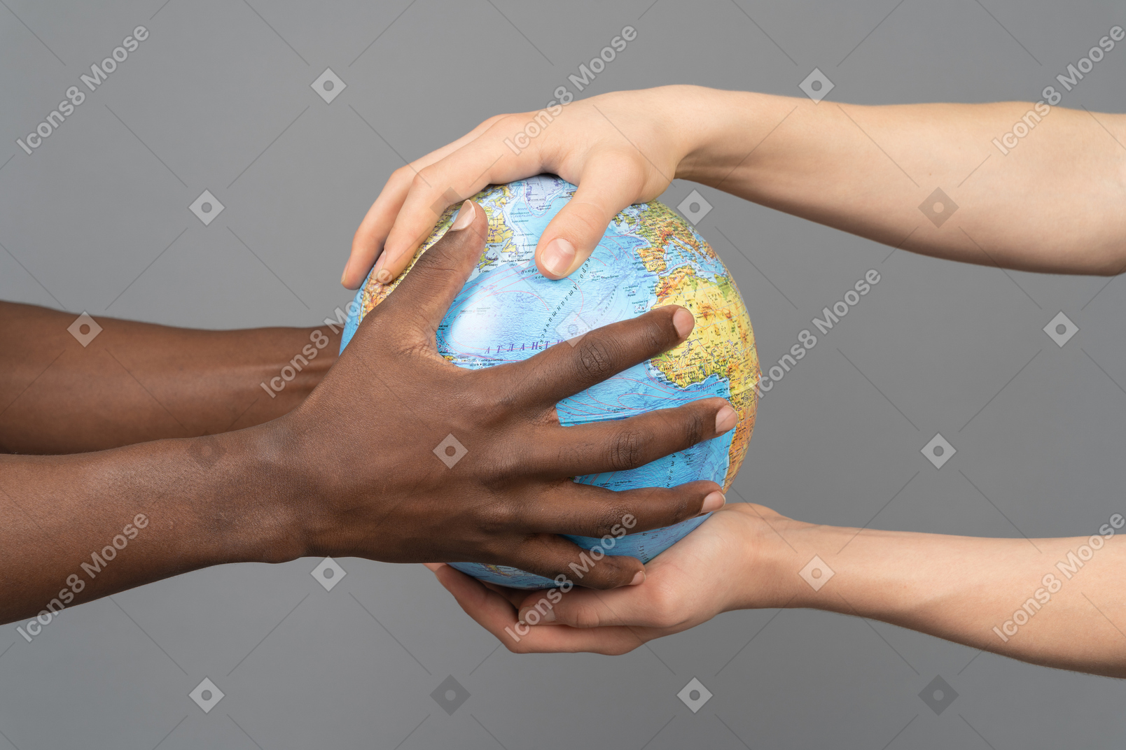 Different hands holding the earth globe