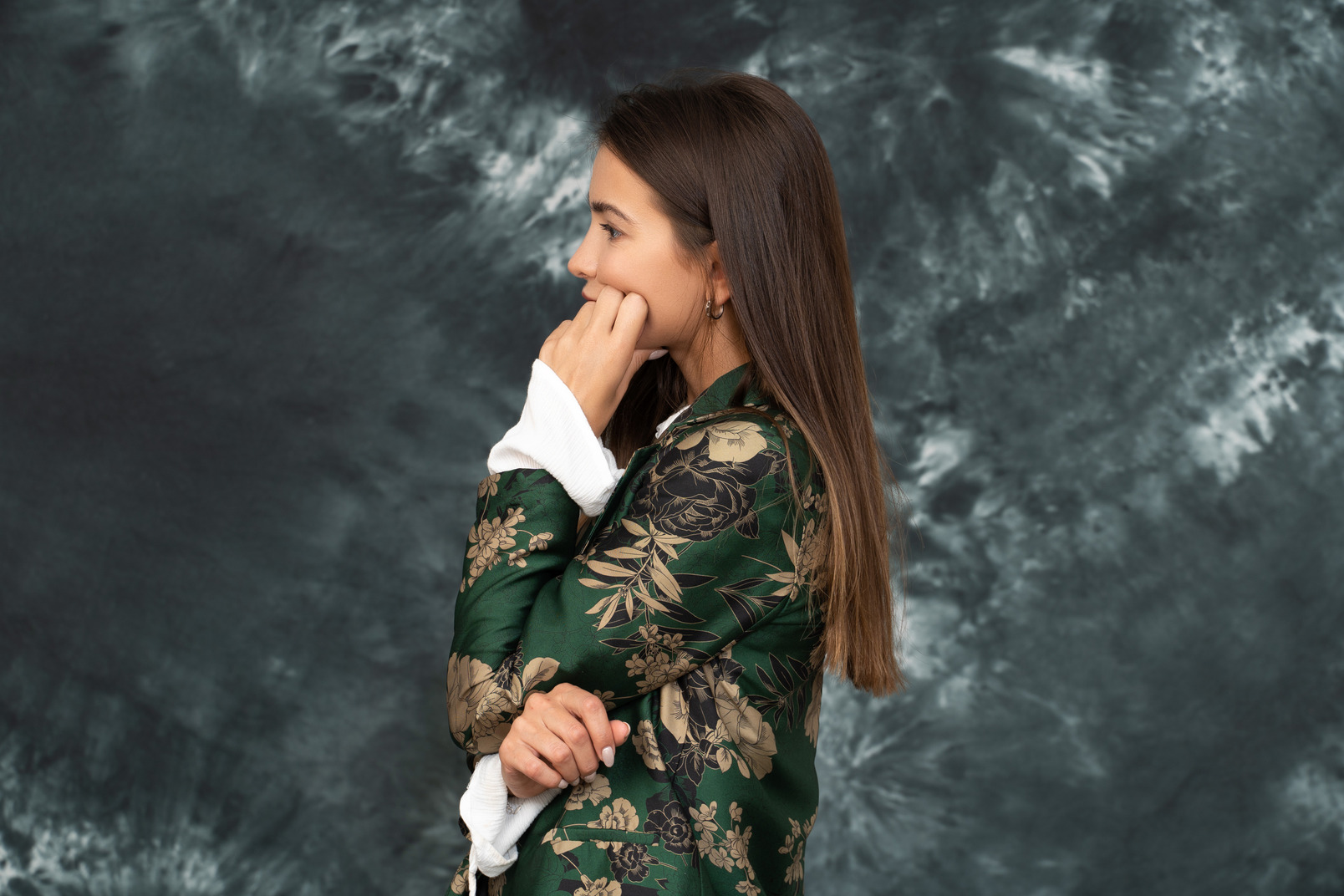 Side shot  of a doubtful woman in silk japanese jacket