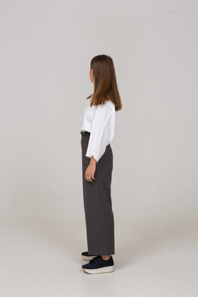 Side view of a young lady in office clothing looking to the right