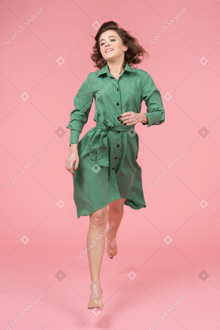Excited girl running toward a camera