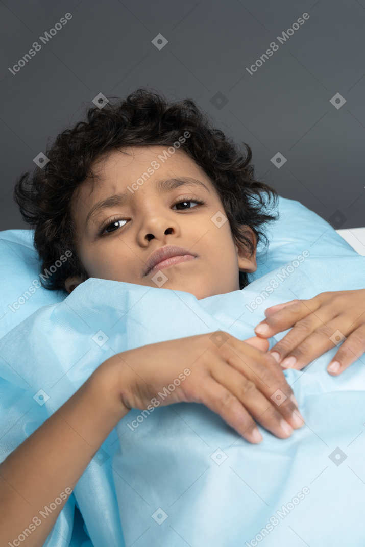 Boy on operating table