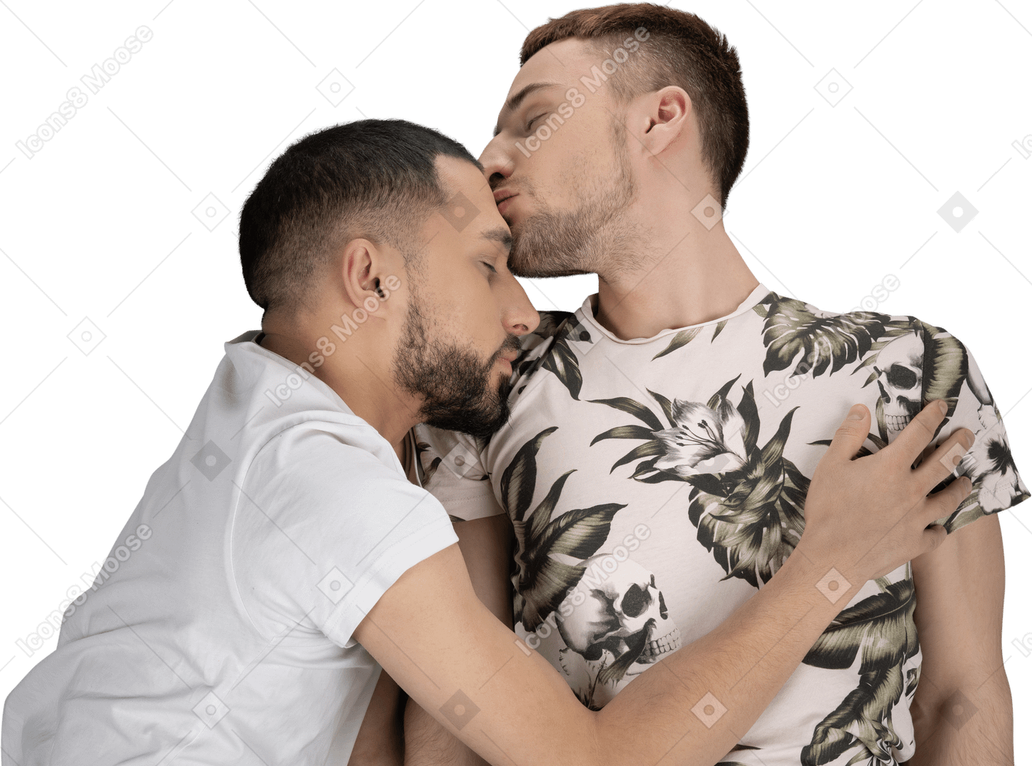 Mise à plat de deux jeunes hommes de race blanche allongés sur le sol s'embrassant et s'embrassant légèrement