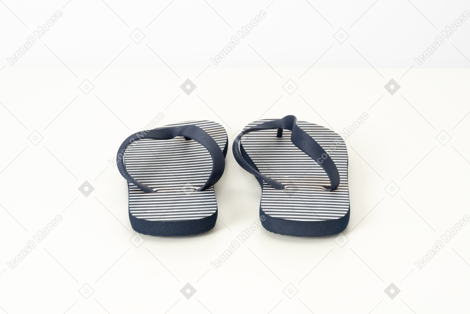 Blue and white flip-flops on a white background