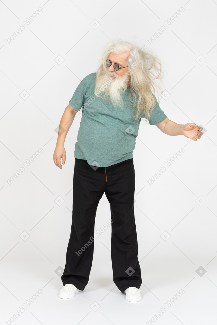 Front view of old man in sunglasses shaking head