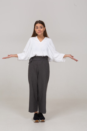 Front view of a young lady in office clothing outspreading arms