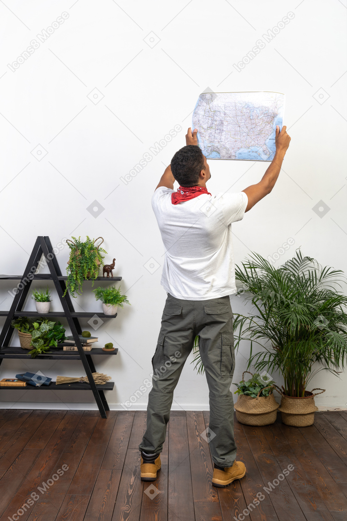 Good looking young man with a map