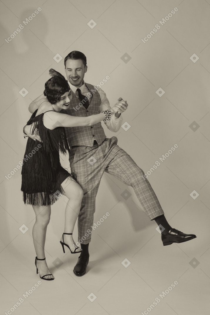 Cheerful man and woman dancing together