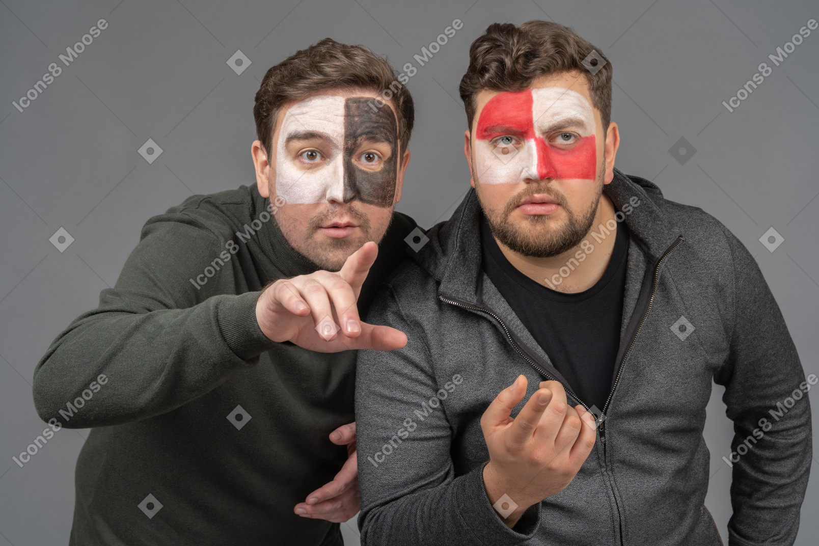 Front view of two male football fans watching football