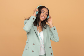 Pretty young girl enjoying music