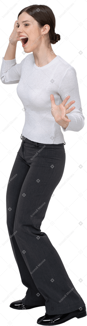 Three-quarter view of a delighted young woman in office clothing