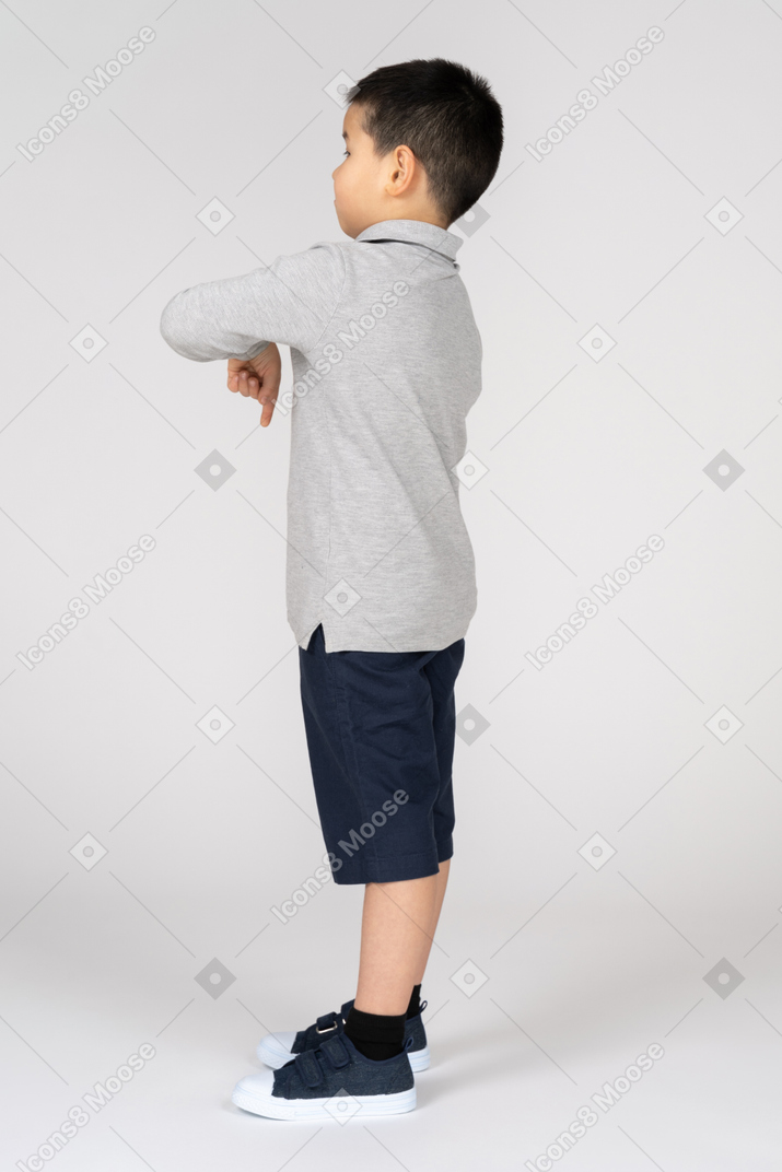 Boy pointing down