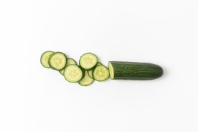 Cut cucumber on white background