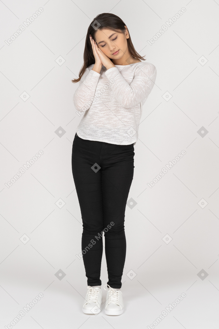Front view of a sleepy young indian female in casual clothing