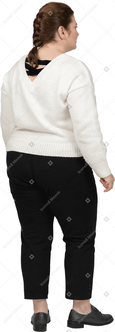 Plump woman in white sweater standing