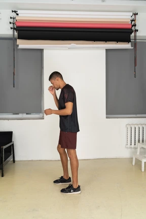 Young man in sports clothes standing