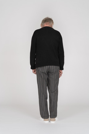 Back view of an old man standing