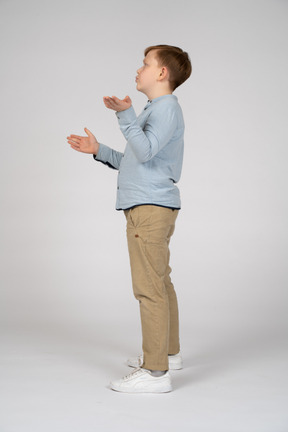 Little boy gesturing and asking something