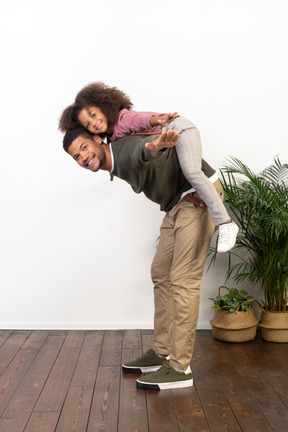 Good looking young man playing with a girl