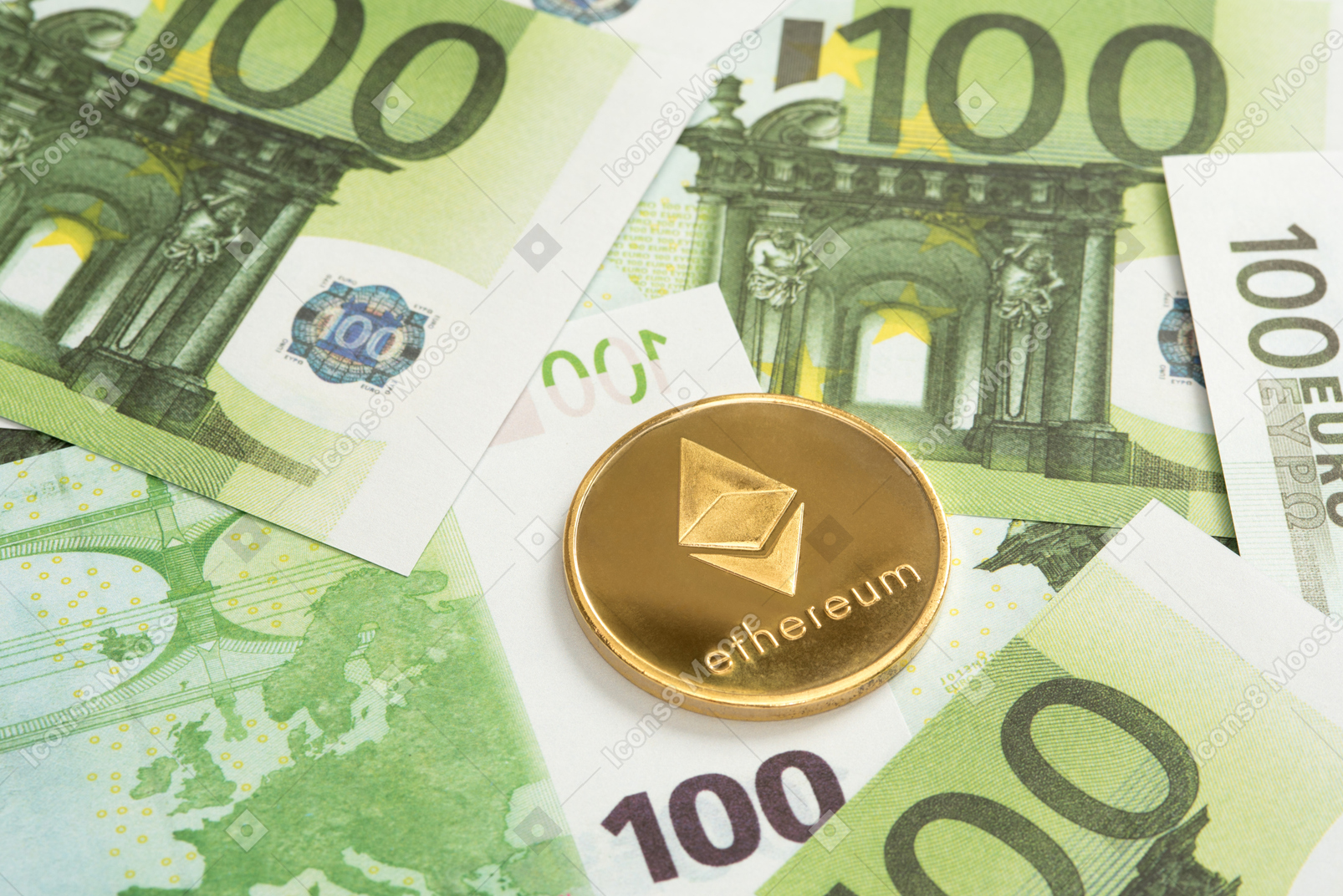 Ethereum coin on one hundred euro banknotes